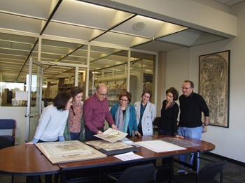 Image of family donating rare maps to the Latin American Library