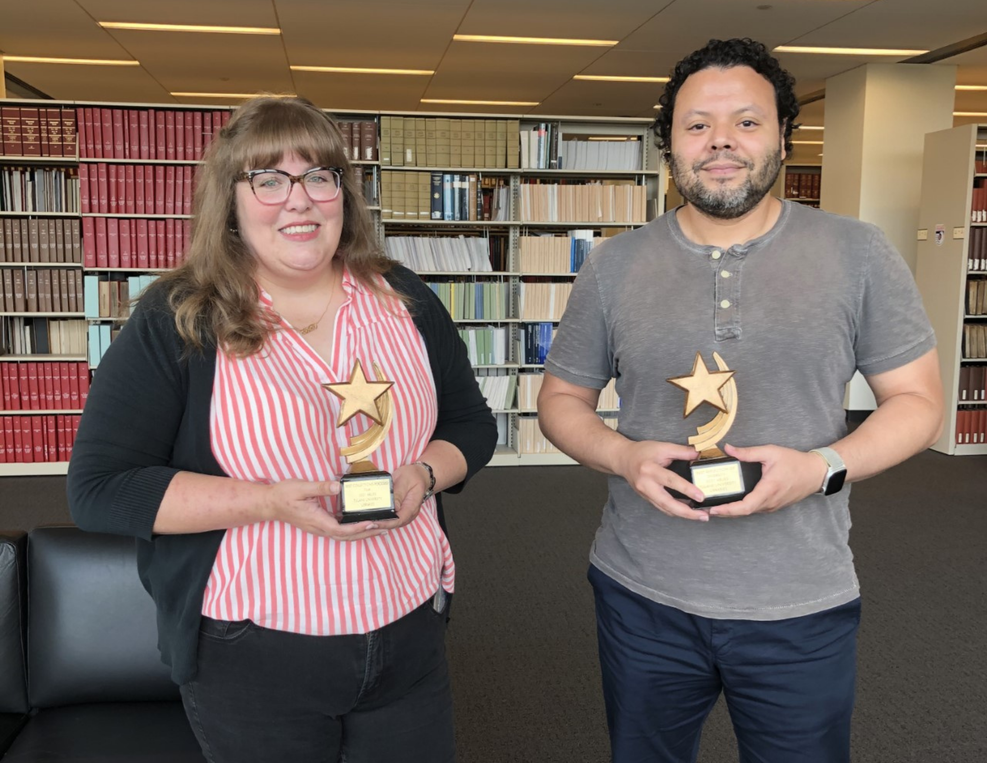 picture of Lori Schexnayder and Alan Velasquez holding their two ARLies awards