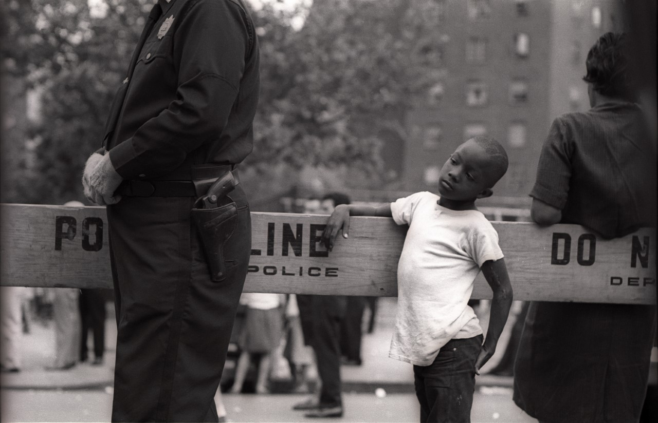 boy standing by police line