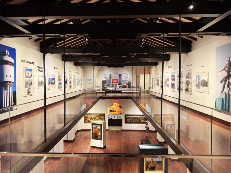 Interior of the gallery looking down from the gallery on the second floor to the first floor. First floor has more traditional art and upstairs is Brumfield's exhibit of modern architecture.