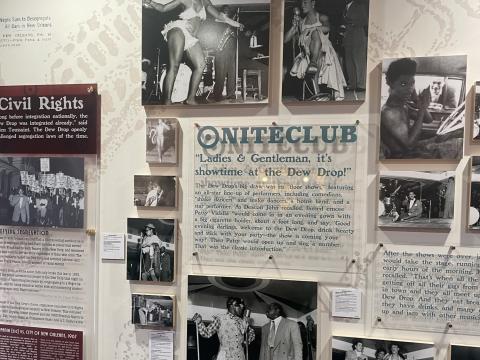 An exhibit wall in the Frank’s Barbershop space of the Dew Drop Inn tells the story of the famed venue, featuring photographs from the Ralston Crawford collection of New Orleans jazz photographs (HJA-098, Hogan Archive, Tulane University Special Collections) and other sources.
