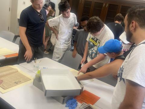 Tulane Bands students view archival materials from the Louis Prima papers during a workshop in the Louis Prima Room, the instruction classroom of Tulane University Special Collections. Photo by Melissa A. Weber, August 2024.