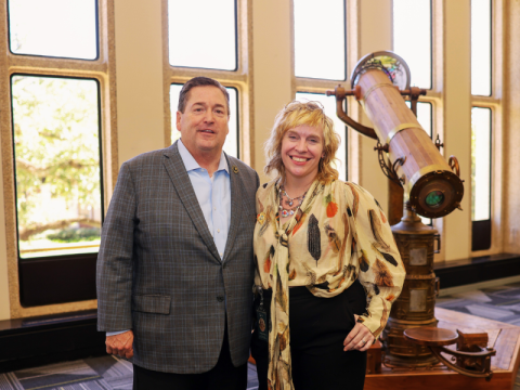 Photo of Lieutenant Governor Nungesser and Dean Lindsay Cronk inside the library standing in front of a Kaleidoscope