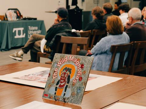 Attendees and archival materials at Intentional Listening: Mardi Gras Indians event on 02/17/2025. Photo by Alan Velasquez.