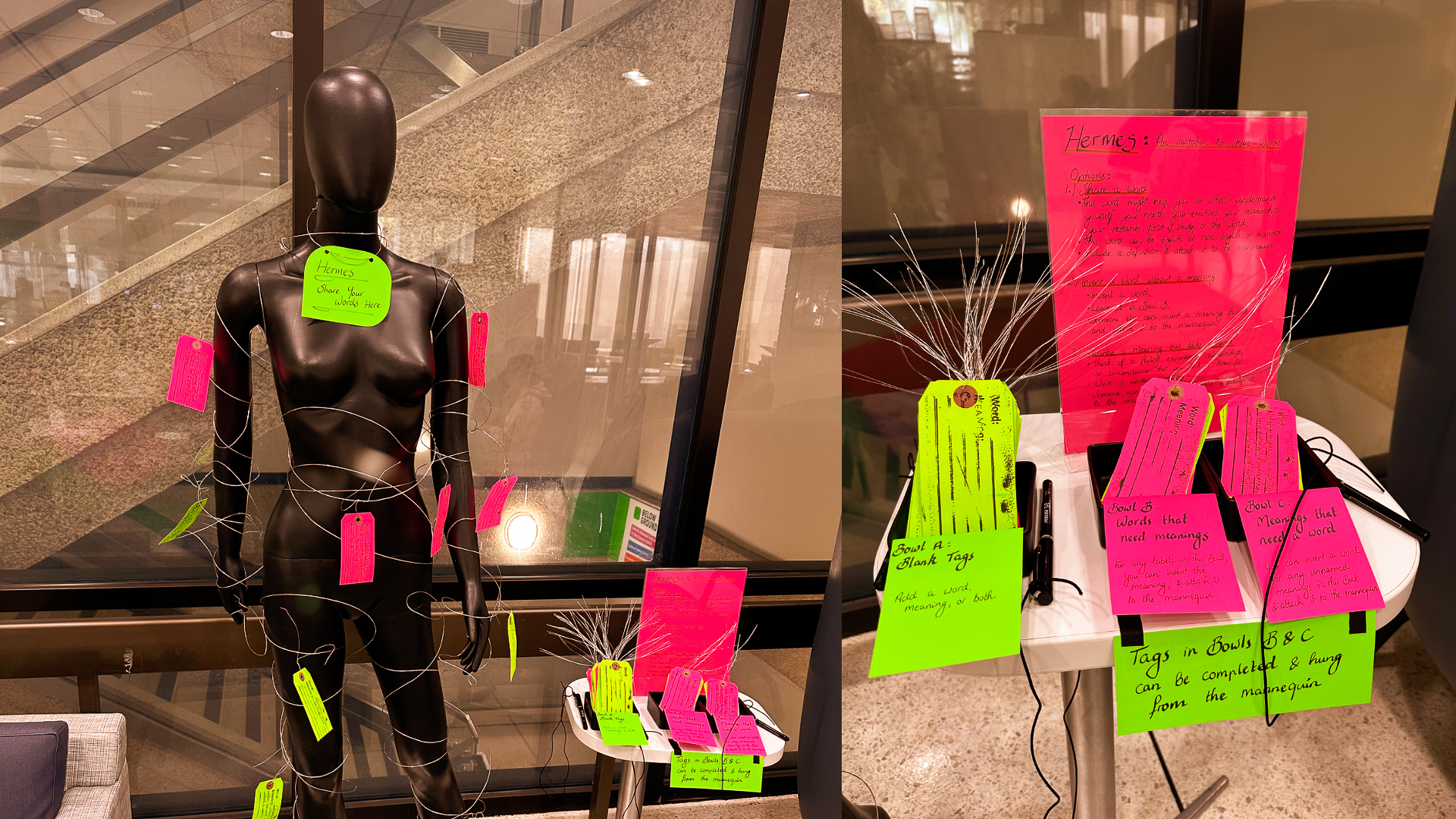 A mannequin wrapped in string with colorful tags attached stands beside a table display with more tags, pens, and instructions, inviting participants to write and hang messages as part of an interactive installation.